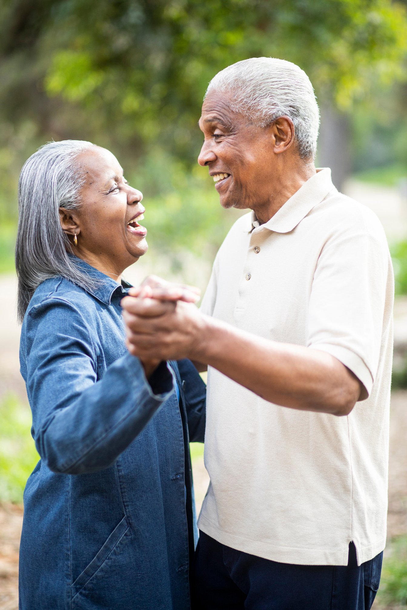 Senior Black Married Couple Slow Dancing Outdoors