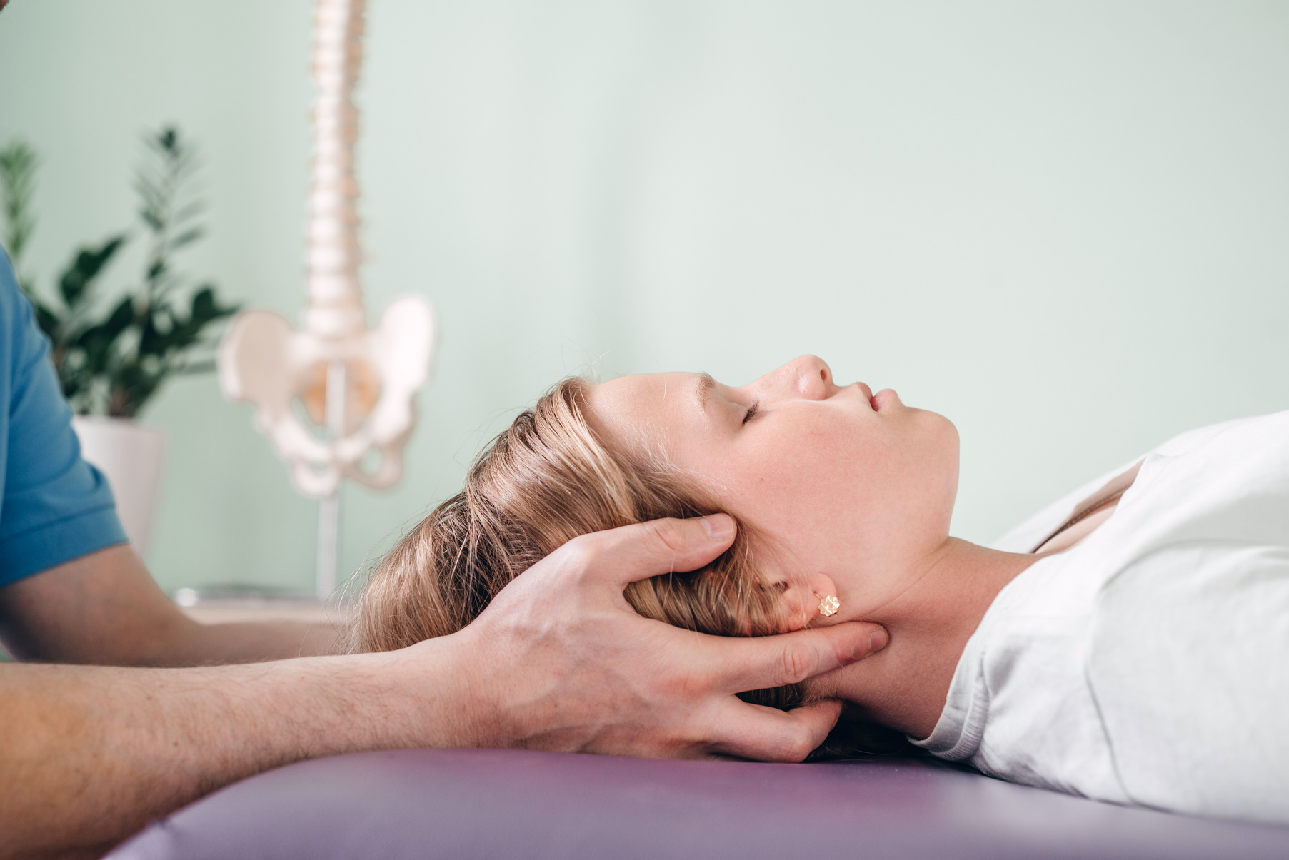 A girl receiving CST treatment. Osteopathic Manipulation and CranioSacral Therapy for children and adults