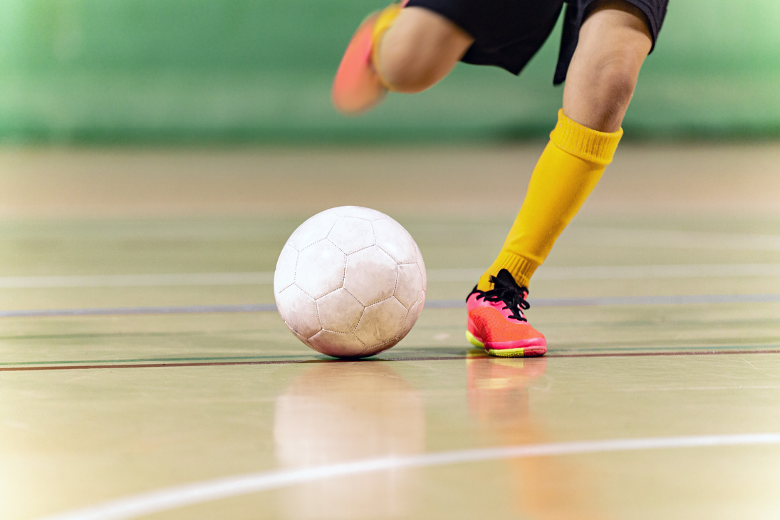 Close-up Image of Futsal Player Kicking Ball. Indoor Soccer Ball