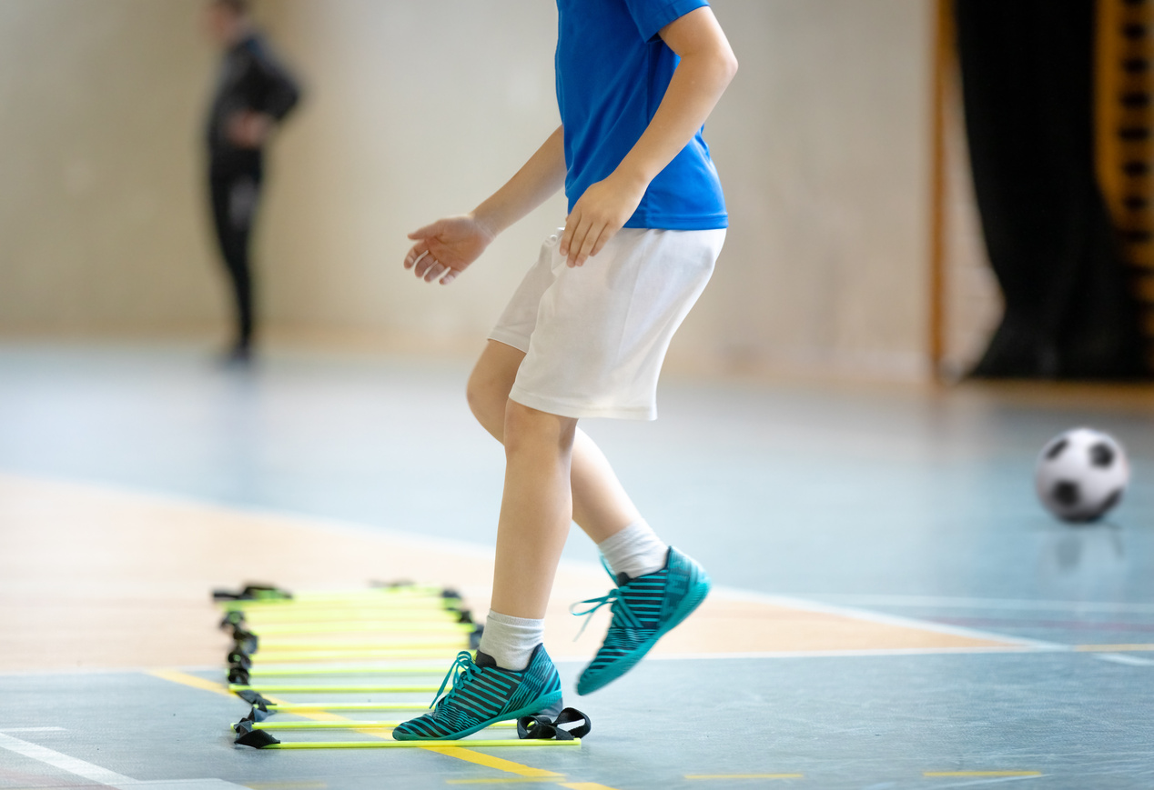 Young Boy at Sports Training at Indoor Court Ladder Drill. Futsa